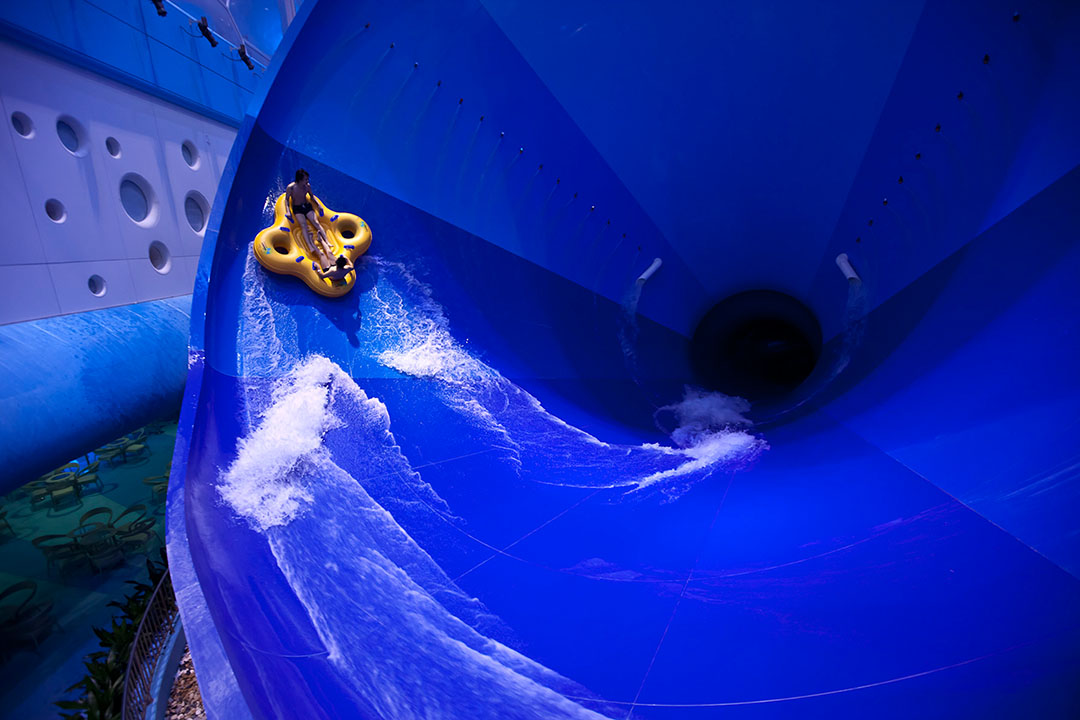 A school of fish overlooks the wave pool at the Happy Water Park constructed within Beijing's Olympic Water Cube.